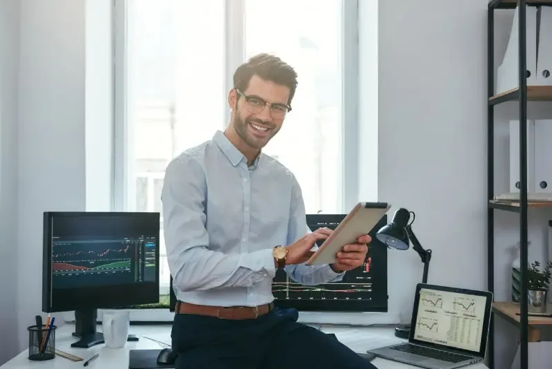 Consultant reviewing analytics on screen at a desk